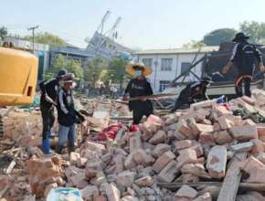 OISCA staff helping to remove debris
