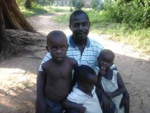 Rural parent brings children for malaria check up