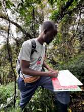 Laurence collecting data during census