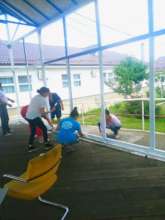 Orphanage staff pitches in to help paint!