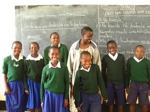 Teacher-in-training, Prisca, with her students