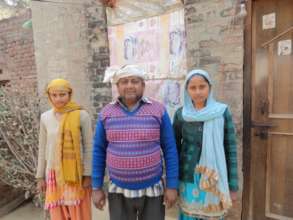 Babita and Savita with their father, Birbal.