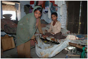 Afsana at home with her younger siblings