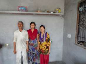 Madhu & Manju (far right) pose with their father