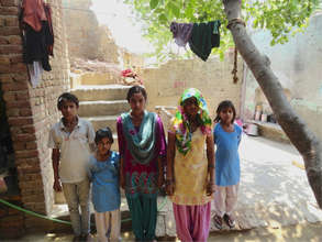 Manju (center, blue scarf) with her mom & siblings