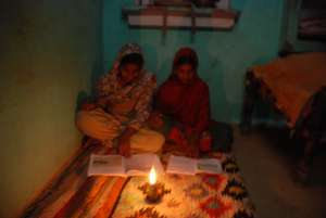 Mausmin and friend studying by kerosene lamplight