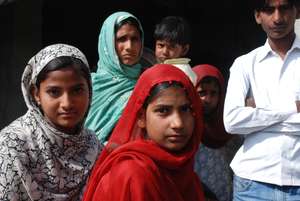 With her friends, siblings and mother