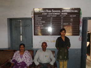 Nisha with the head master and her teacher