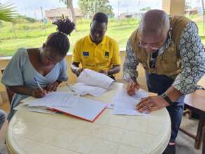Signing the project completion and handover