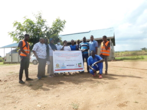 Picture with Health workers with project banner