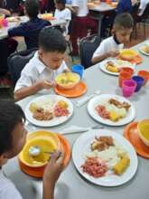 Students eating soup and main course