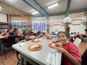 Students at lunch time. Check the wall posters