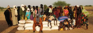 Teyiss community poses with food distribution.