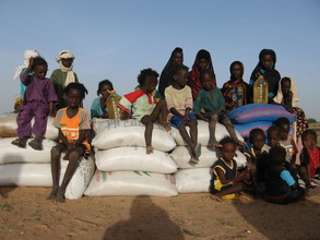 Children receive food aid in Teyiss.
