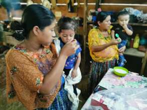 Mothers learning and feeding their children