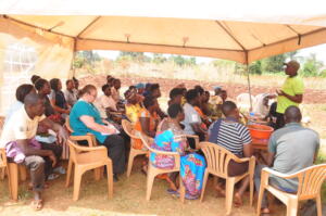 The farmers listening attentively to the trainer