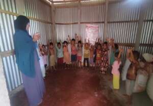 Kids are with facilitator in a Feeder School