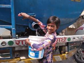 Girl fetching safe drinking water