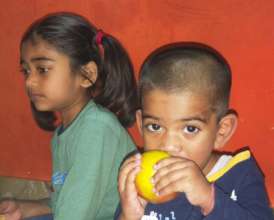 Kids eating fruits