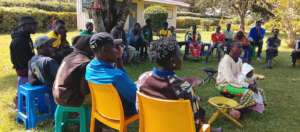 Group listening intently to Rose