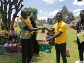 Omari receiving his Certificate
