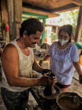 Heriberto teaching pottery