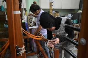 DAWN's Gilda Mosatalla assists in thread beaming