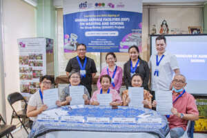 DAWN & DTI officials with guest at MOA signing