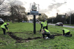 Planting 4,000 crocus corms for 'End Polio Now'