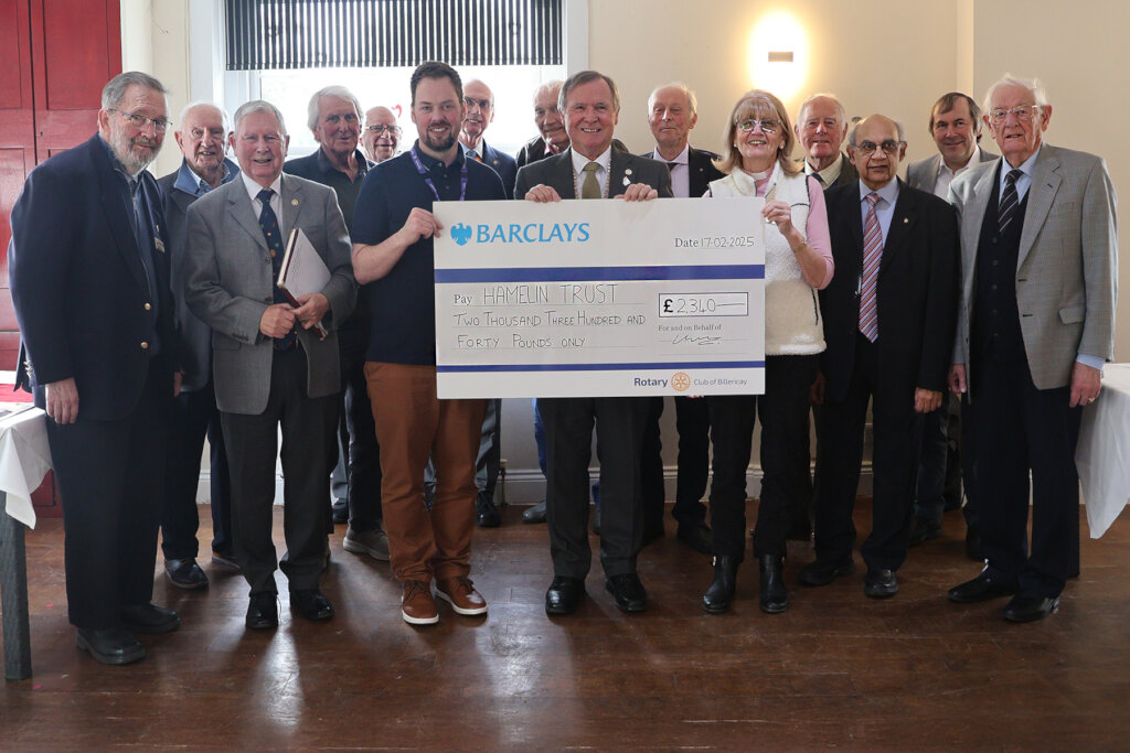 Club members present the donation to Hamelin House
