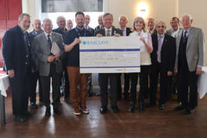 Club members present the donation to Hamelin House