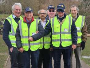 President Patrick (blindfolded) plus supporters