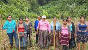 Women planting fruit trees at Camp Contour Lines