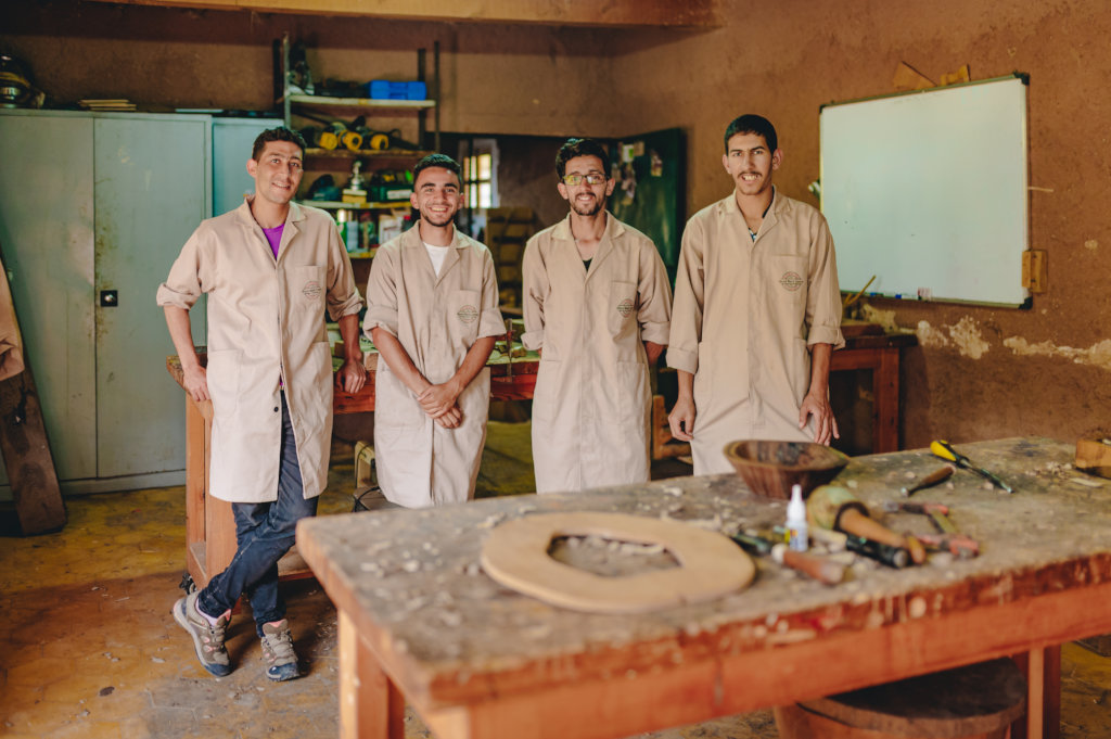 Train eight young Berber men in woodworking skills