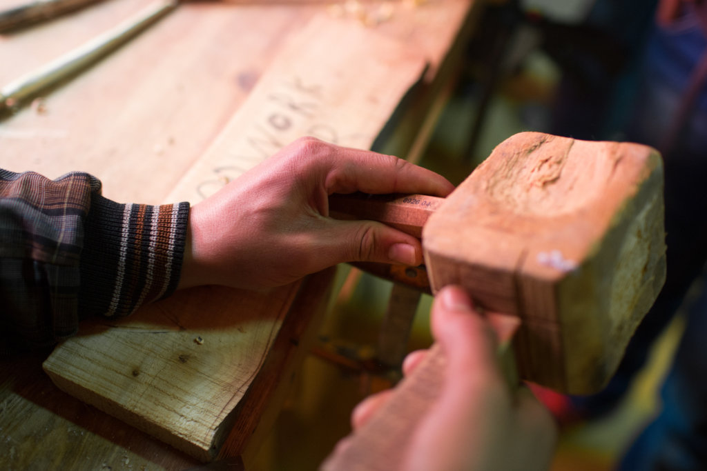 Train eight young Berber men in woodworking skills
