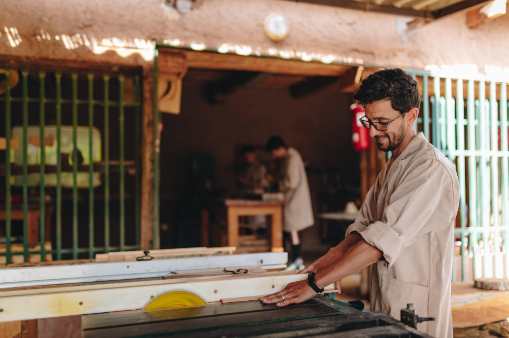 Train eight young Berber men in woodworking skills