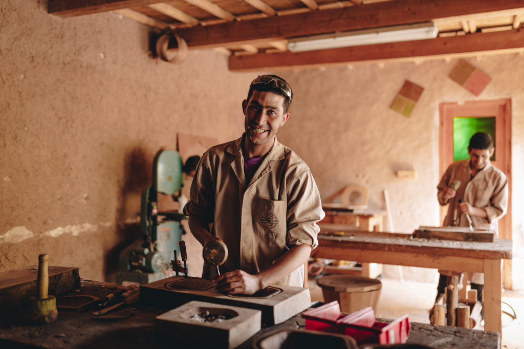 Train eight young Berber men in woodworking skills