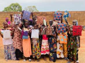 School-age girls with feminine-hygiene kits