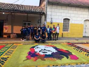 Scholars participating in the sawdust carpets