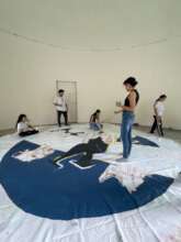Painting a giant kite for a community art event