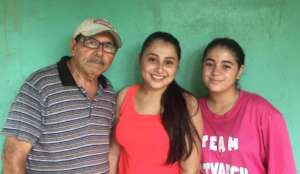 Scholarship student Tania (centre) with her family