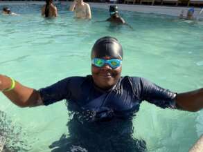 A participant enjoying their swim lesson at TRH