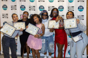 Swim Corps graduates with their certificates