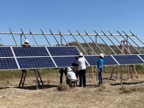 Tribal Members install ground-mount solar array