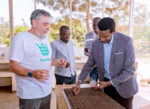 Mr. Daniel Rwebigo sowing vegetable seeds