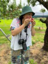 Bibi eating a peach in Japan