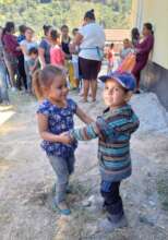Kids dancing during the Christmas food delivery