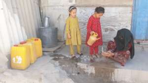 Ahmad's twin daughters near the grocery store he o