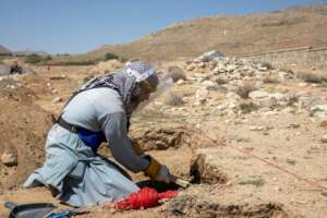 HALO deminer searching for IEDs around the clinic