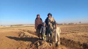 Salih with his sons on their land